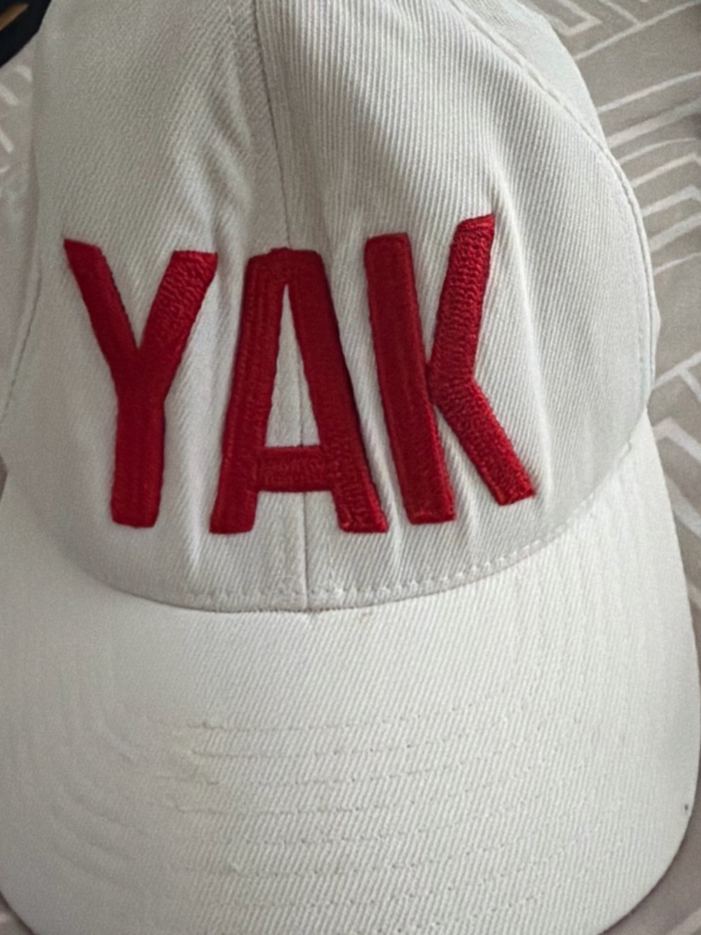 G/FORE White Baseball Cap with Red 'YAK' Embroidery